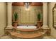 Spa-like bathroom showcasing a luxurious soaking tub with views, enhancing a serene and relaxing atmosphere at 9290 E Thompson Peak Pkwy # 409, Scottsdale, AZ 85255