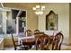 Dining room with wood table and chairs plus views of the patio and backyard at 9290 E Thompson Peak Pkwy # 409, Scottsdale, AZ 85255