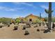 Expansive desert home featuring beautiful cacti and desert landscaping at 9290 E Thompson Peak Pkwy # 409, Scottsdale, AZ 85255