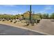 Desert home with mature landscaping and a circular driveway at 9290 E Thompson Peak Pkwy # 409, Scottsdale, AZ 85255