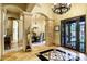 Impressive foyer with marble floors, decorative columns, and a view into the dining room at 9290 E Thompson Peak Pkwy # 409, Scottsdale, AZ 85255