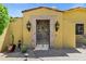 Front gate featuring a stone surround and decorative ironwork at 9290 E Thompson Peak Pkwy # 409, Scottsdale, AZ 85255