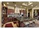 Beautiful kitchen showcasing cherry cabinets, granite countertops, and a functional center island at 9290 E Thompson Peak Pkwy # 409, Scottsdale, AZ 85255