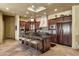 Gourmet kitchen with custom cabinets, granite countertops, and a unique ceiling mural at 9290 E Thompson Peak Pkwy # 409, Scottsdale, AZ 85255