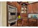Double oven and custom cabinets in a kitchen with granite countertops and custom tile at 9290 E Thompson Peak Pkwy # 409, Scottsdale, AZ 85255