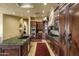 Gourmet kitchen with cherry cabinets, granite countertops, and a view into another living area at 9290 E Thompson Peak Pkwy # 409, Scottsdale, AZ 85255
