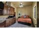 Elegant bedroom with an attached bar area, large window, and outdoor access at 9290 E Thompson Peak Pkwy # 409, Scottsdale, AZ 85255