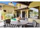 Covered patio with comfortable seating, decorative plants and landscaping, providing an inviting outdoor space at 9290 E Thompson Peak Pkwy # 409, Scottsdale, AZ 85255