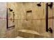 Modern shower with multiple showerheads and a built-in bench for a luxurious bathing experience at 9290 E Thompson Peak Pkwy # 409, Scottsdale, AZ 85255