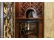 Close up view of a wine storage cabinet with decorative iron detail and integrated wine refrigerator at 9290 E Thompson Peak Pkwy # 409, Scottsdale, AZ 85255