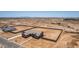 Overhead aerial of a single-Gathering home showcasing large, block-fenced backyard in a desert landscape setting at 9485 W Sandstone Mountain Dr, Casa Grande, AZ 85194