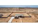 High angle aerial shot of a single-Gathering home with an expansive backyard and block fencing in a desert landscape at 9485 W Sandstone Mountain Dr, Casa Grande, AZ 85194