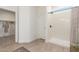 Bright bathroom with a walk-in shower, light-colored flooring, and a view into the walk-in closet at 9485 W Sandstone Mountain Dr, Casa Grande, AZ 85194