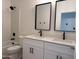 Bathroom featuring a dual vanity, black hardware and fixtures, and a shower over tub setup at 9485 W Sandstone Mountain Dr, Casa Grande, AZ 85194
