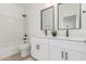 Bathroom featuring double sinks, dark hardware, and a shower-tub combination at 9485 W Sandstone Mountain Dr, Casa Grande, AZ 85194