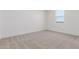 This is a bedroom featuring plush carpet and a window at 9485 W Sandstone Mountain Dr, Casa Grande, AZ 85194