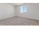 Cozy bedroom featuring carpet floors, a window with a view, and ample natural light at 9485 W Sandstone Mountain Dr, Casa Grande, AZ 85194