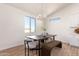 Dining area with modern lighting, a dining table, chairs, and natural light at 9485 W Sandstone Mountain Dr, Casa Grande, AZ 85194