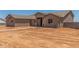 Exterior of a one-story tan home with desert landscaping and blue sky at 9485 W Sandstone Mountain Dr, Casa Grande, AZ 85194