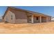 The backyard is still under construction at this single-story home at 9485 W Sandstone Mountain Dr, Casa Grande, AZ 85194