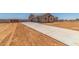 Attached two car garage with concrete drive and desert landscaping at new construction at 9485 W Sandstone Mountain Dr, Casa Grande, AZ 85194