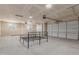 This is a spacious garage with multiple overhead doors and windows at 9485 W Sandstone Mountain Dr, Casa Grande, AZ 85194