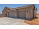 Side view of newly constructed garage with concrete drive at 9485 W Sandstone Mountain Dr, Casa Grande, AZ 85194