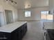 Stylish island kitchen features granite countertops, modern appliances, and an open floor plan at 9485 W Sandstone Mountain Dr, Casa Grande, AZ 85194