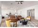 Stylish living room with vaulted ceilings, modern rug, comfortable seating, and easy access to kitchen at 9485 W Sandstone Mountain Dr, Casa Grande, AZ 85194