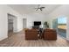 Open living room with vaulted ceiling, modern furniture, and sliding glass doors for natural light at 9485 W Sandstone Mountain Dr, Casa Grande, AZ 85194