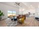 Inviting living room with vaulted ceilings, modern furniture, and sliding glass doors for natural light at 9485 W Sandstone Mountain Dr, Casa Grande, AZ 85194