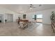 Open living room features neutral color palette, area rug, and sliding glass doors at 9485 W Sandstone Mountain Dr, Casa Grande, AZ 85194