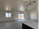 Bright, open floor plan showcases large windows, vaulted ceilings, and stylish light fixtures in this house at 9485 W Sandstone Mountain Dr, Casa Grande, AZ 85194