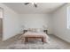 Spacious main bedroom featuring carpet floors and neutral tones, with a ceiling fan and natural light at 9485 W Sandstone Mountain Dr, Casa Grande, AZ 85194