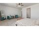 View of the main bedroom featuring carpet, a sitting area, and a glimpse of the adjoining bathroom at 9485 W Sandstone Mountain Dr, Casa Grande, AZ 85194