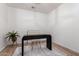 Minimalist office area featuring a modern black desk on top of an area rug and light, wooden floors at 9485 W Sandstone Mountain Dr, Casa Grande, AZ 85194