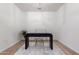 Minimalist office area featuring a modern black desk on top of an area rug and light, wooden floors at 9485 W Sandstone Mountain Dr, Casa Grande, AZ 85194