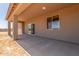 A covered patio and a sliding glass door provide an inviting outdoor space at 9485 W Sandstone Mountain Dr, Casa Grande, AZ 85194