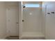 Sleek new shower stall with tiled walls, and black fixtures for a modern look at 9485 W Sandstone Mountain Dr, Casa Grande, AZ 85194