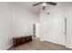 Spacious bedroom featuring wood floors, large closets, and a modern ceiling fan at 9566 E Plana Ave, Mesa, AZ 85212