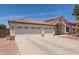 Charming single-story home featuring a three-car garage and desert landscaping in a well-kept neighborhood at 9566 E Plana Ave, Mesa, AZ 85212