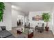 Inviting living room with gray plank floors and modern decor at 9566 E Plana Ave, Mesa, AZ 85212