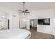 Open main bedroom with a ceiling fan, walk-in closet, and access to a private ensuite bathroom at 9566 E Plana Ave, Mesa, AZ 85212