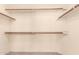 Walk-in closet with built-in shelves and rods for organized storage at 9802 W Rockwood Dr, Peoria, AZ 85382