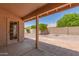Covered patio overlooking the backyard, perfect for outdoor dining and relaxation at 9802 W Rockwood Dr, Peoria, AZ 85382