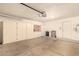 Spacious garage with storage cabinets, providing ample room for vehicles and organization at 9802 W Rockwood Dr, Peoria, AZ 85382