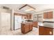 Efficient kitchen featuring an island and white appliances at 9802 W Rockwood Dr, Peoria, AZ 85382
