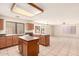 Spacious kitchen with a center island, tile floors, and ample counter space at 9802 W Rockwood Dr, Peoria, AZ 85382