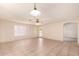 Bright open living room featuring tile flooring and a ceiling fan at 9802 W Rockwood Dr, Peoria, AZ 85382