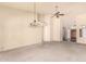 Spacious living room featuring high ceilings, neutral carpet, and a sliding glass door to the patio at 9802 W Rockwood Dr, Peoria, AZ 85382